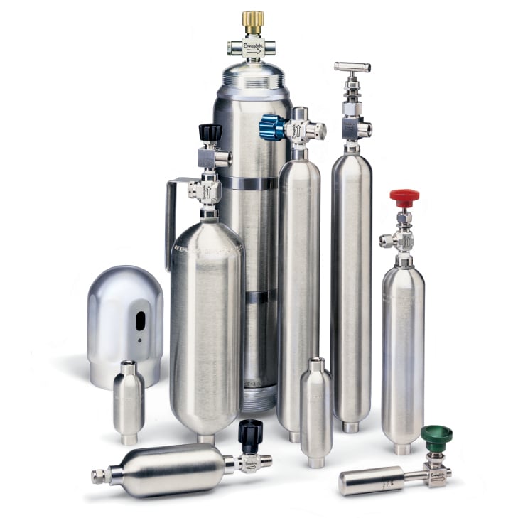 Photograph of various Swagelok sample cylinders including single-ended, double-ended, miniature, end cap and rupture disc tees assembled