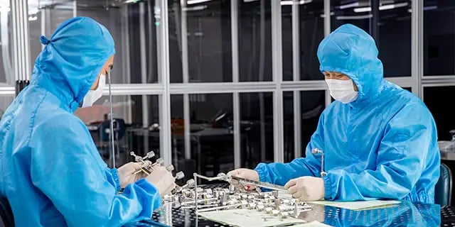 semiconductor cleanroom associates at work